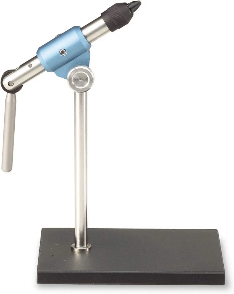 Tiemco Fly Tying Solid Vise - The TMC Solid Vise has a rotating head and a hinged shaft for more versatility. It will hold hooks from #32 to #4. Blue anodized center housing stands for the image of high quality Tiemco products. Model Number: 30364UPC: 052857303643