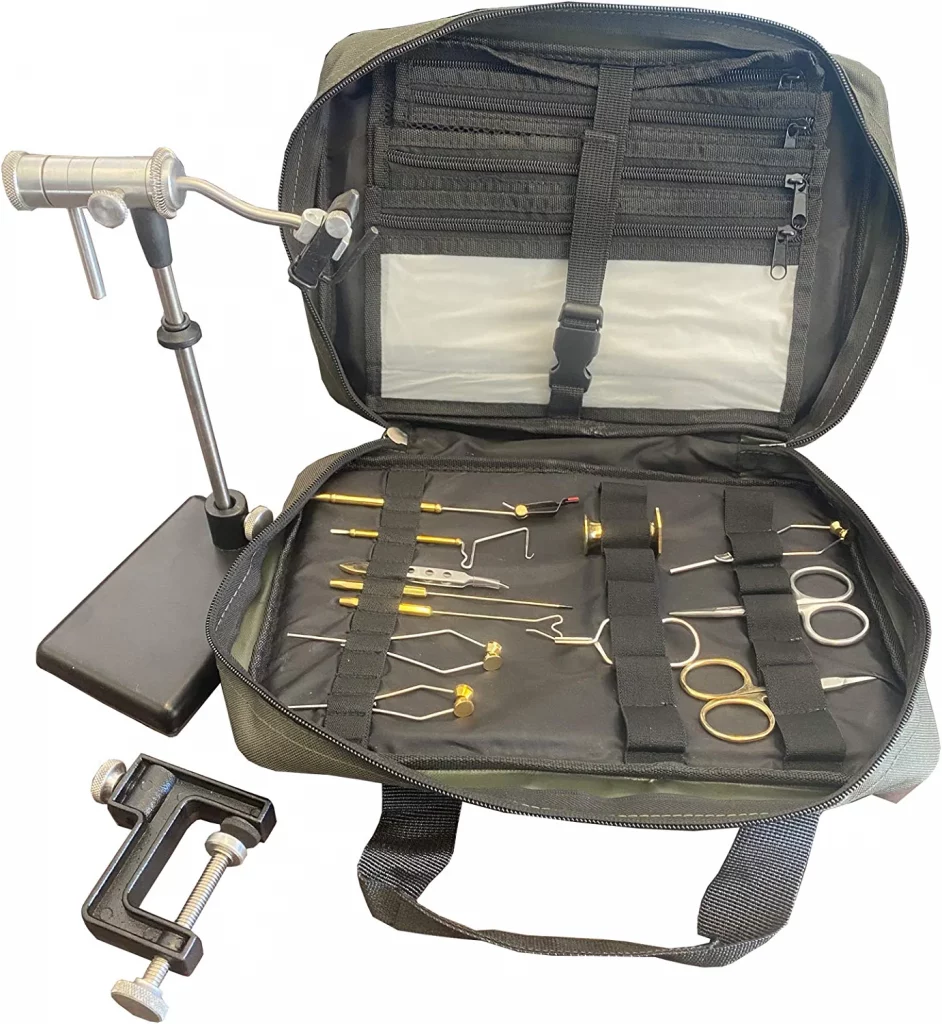 Zephr Travel Fly Tying Kit w/ Travel Bag. Deluxe Assortment of 12 Tools and a EZ Rotary Vise included. Nice and durable traveling bag included. Tools included are: hair stacker, two bobbins, rotating hackle pliers, two scissors, whip finishing tool, bodkin pick, bobbin theader, dubbing twister, tweezers. Vise with interchangeable base/clamp and carrying case.