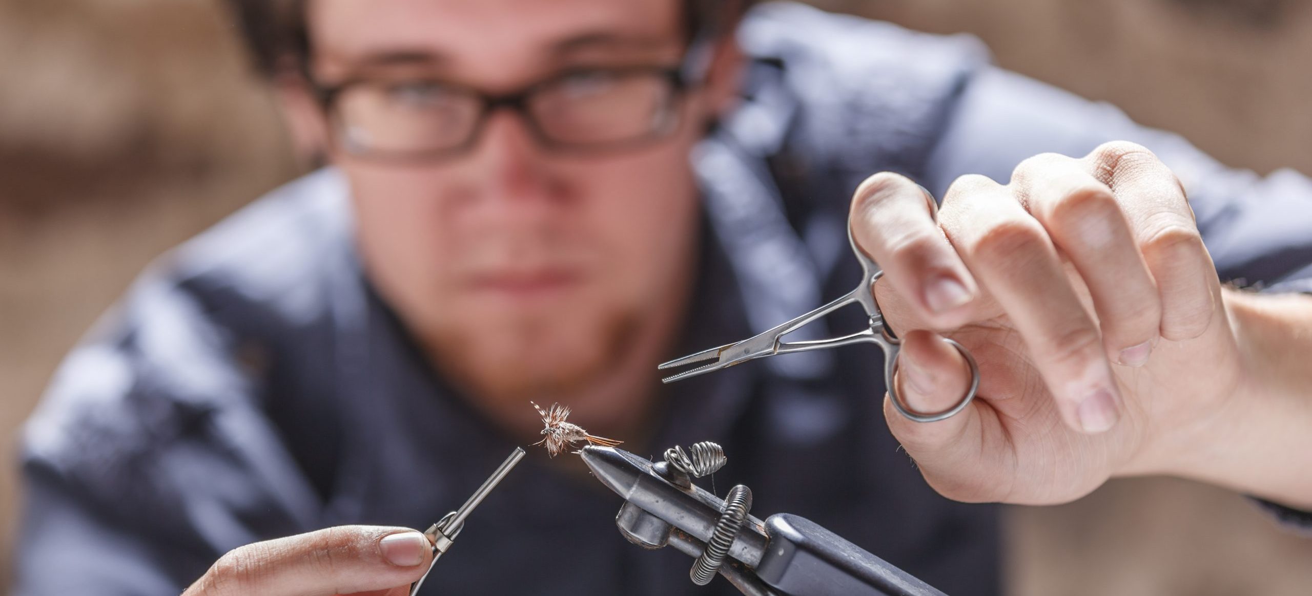 Man tying fly for fly fishing